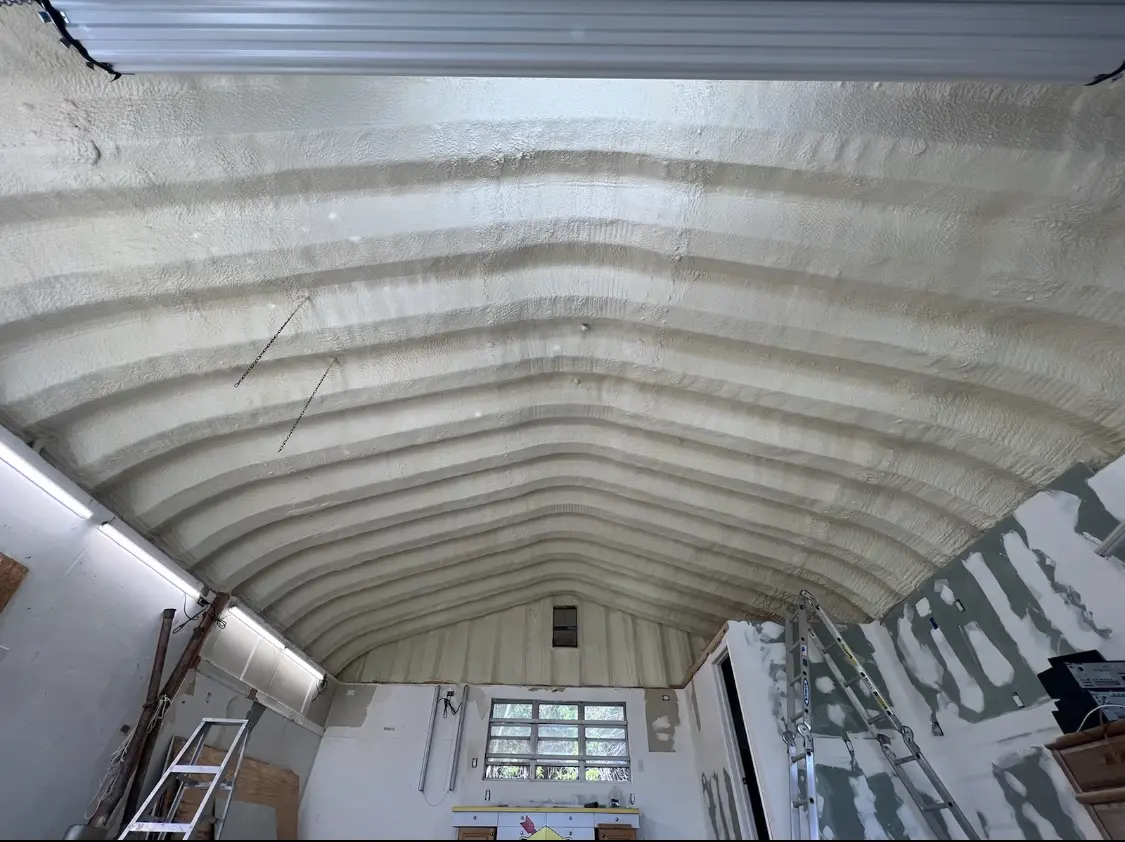 Spray polyurethane foam applied to the underside of a metal roof deck in Annandale